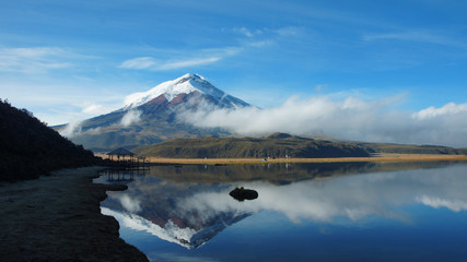 Cotopaxi volcano reflected in the water of Limpiopungo lagoon on a cloudy morning - Ecuador