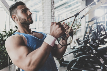 Calm man working out in keep-fit studio