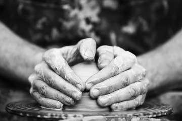 Potter making ceramic pot on the pottery wheel