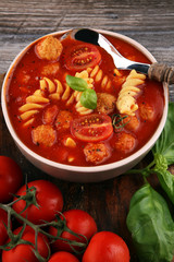 Tomato soup with meatballs in a bowl. Italian minestrone soup