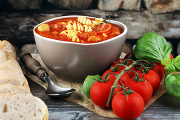 Tomato soup with meatballs in a bowl. Italian minestrone soup