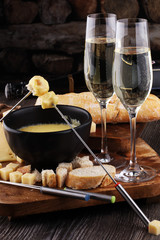 Gourmet Swiss fondue dinner on a winter evening with assorted ch