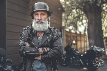 Cheerful smiling old man in helmet