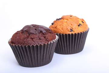 Fresh homemade muffins isolated on white background. Top view.