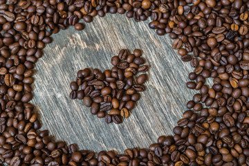 Coffee beans on a wooden background