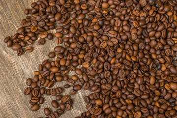 Coffee beans on a wooden background
