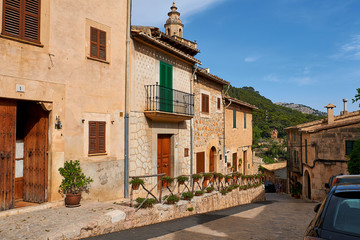 Old European street decorated with fresh flowers city of Valldemossa. Palma de Mallorca. Spain.