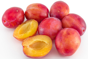 Fresh plums isolated on white background