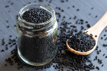 Black cumin seeds in a glass jar