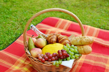 Basket with Food Fruit Bakery Picnic Green Grass Summer Time Rest Background 
