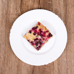 Vegetarian food on a plate with wooden background