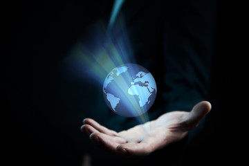 hand holding the world  in screen