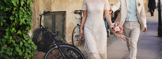 Young and happy married couple walking around