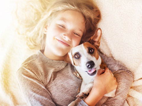 Smiling child with dog