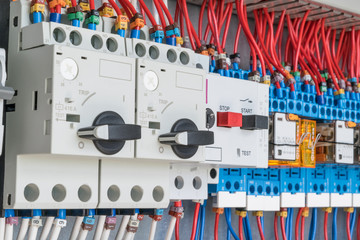 n the electrical control panel are circuit breakers protecting the motor and relay. Circuit breakers with rotary handles and push-button and arranged in a row. Wires with ferrules number coded.