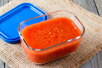 Tomato juice in a glass container