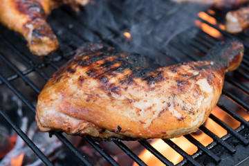 Grilled Roasted chicken legs on a grill