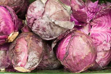 Fototapeta na wymiar Red cabbage red cabbage bright lilac color on the store counter sale of red cabbage
