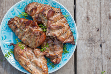 Grilled chicken breasts smoked on a grill