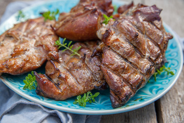 Grilled chicken breasts smoked on a grill