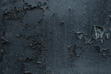 The texture of the metal door with shabby paint