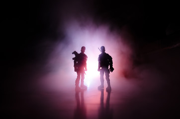 Fototapeta premium Anti-riot police give signal to be ready. Government power concept. Police in action. Smoke on a dark background with lights. Blue red flashing sirens. Dictatorship power.