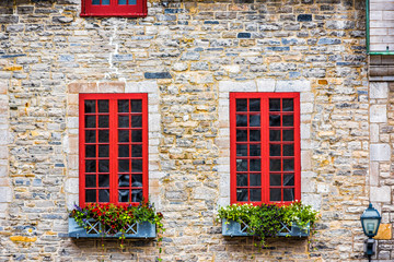 Fototapeta na wymiar Colorful european stone houses buildings in old city decorated with flowers in summer