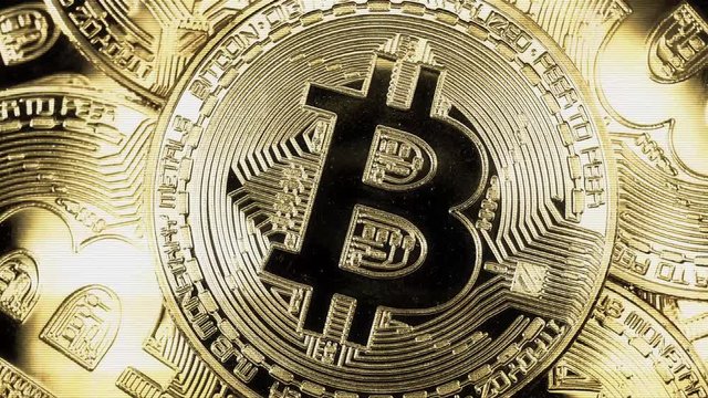 Crypto currency Gold Bitcoin - BTC - Bit Coin. Macro shots crypto currency Bitcoin coins rotating. Holomatrix style. Seamless looping.