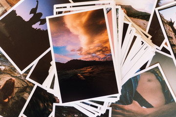 Printed photos on table