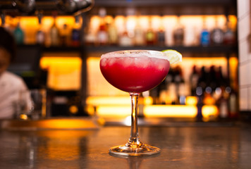 Cranberry cocktail at a busy uptown bar