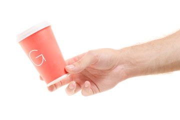 Cup of coffee with a lid in male hands 
