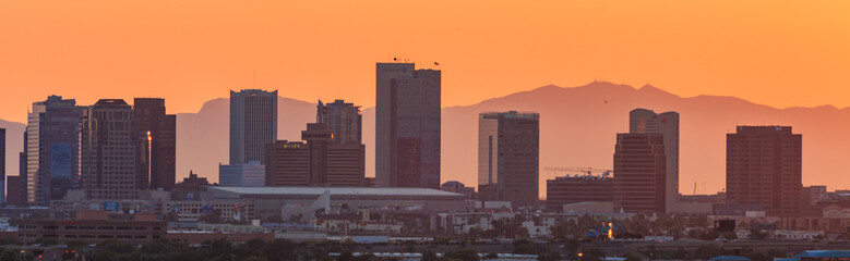 Fototapeta na wymiar downtown Phoenix, Arizona skyline with famous camelback mountain at sunset