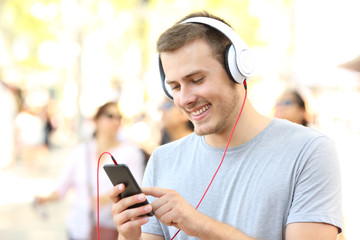 Boy listening to music and selecting song