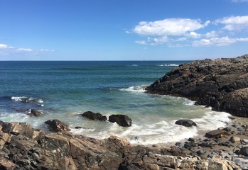 Fototapeta na wymiar high tide with waves on Ogunquit beach, Maine