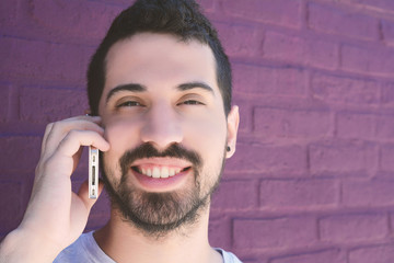 Latin man talking on the phone