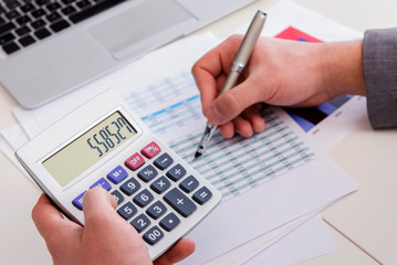 Finance analyst looking and financial reports