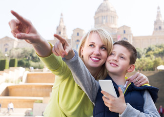 Mother and son looking sightseeing tour