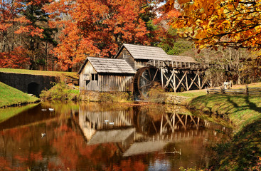 Fototapeta na wymiar Mabry Mill with pond, one of the attractions on Blue Ridge Parkway, Virginia USA in Autumn.