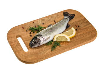 Trout fish on wooden board isolated without shadow