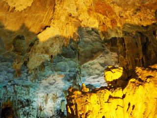 Stalactite in cave with yellow light up decoration