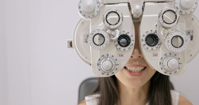 Woman is visiting oculist in clinic