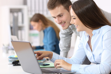 Colleagues coworking on line at office