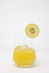 Orange juice with ice and golden kiwi fruit