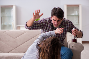 Domestic violence concept in a family argument with drunk alcoho