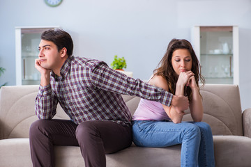 Fototapeta premium Young family in broken relationship concept