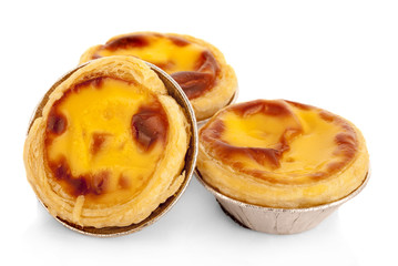 Egg tart sweet custard pie in foil cup isolated on white background