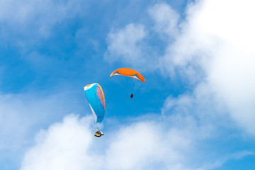 Raraplane flying in the beautiful sky. Tropical Bali island, Indonesia. Extreme sport.