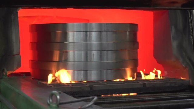 Hardening of parts in the furnace at the factory. Slow motion.
