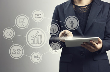 businesswomen  press on smartphone and laptop with connection line logo