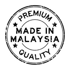 Grunge black premium quality made in Malaysia round rubber seal stamp on white background